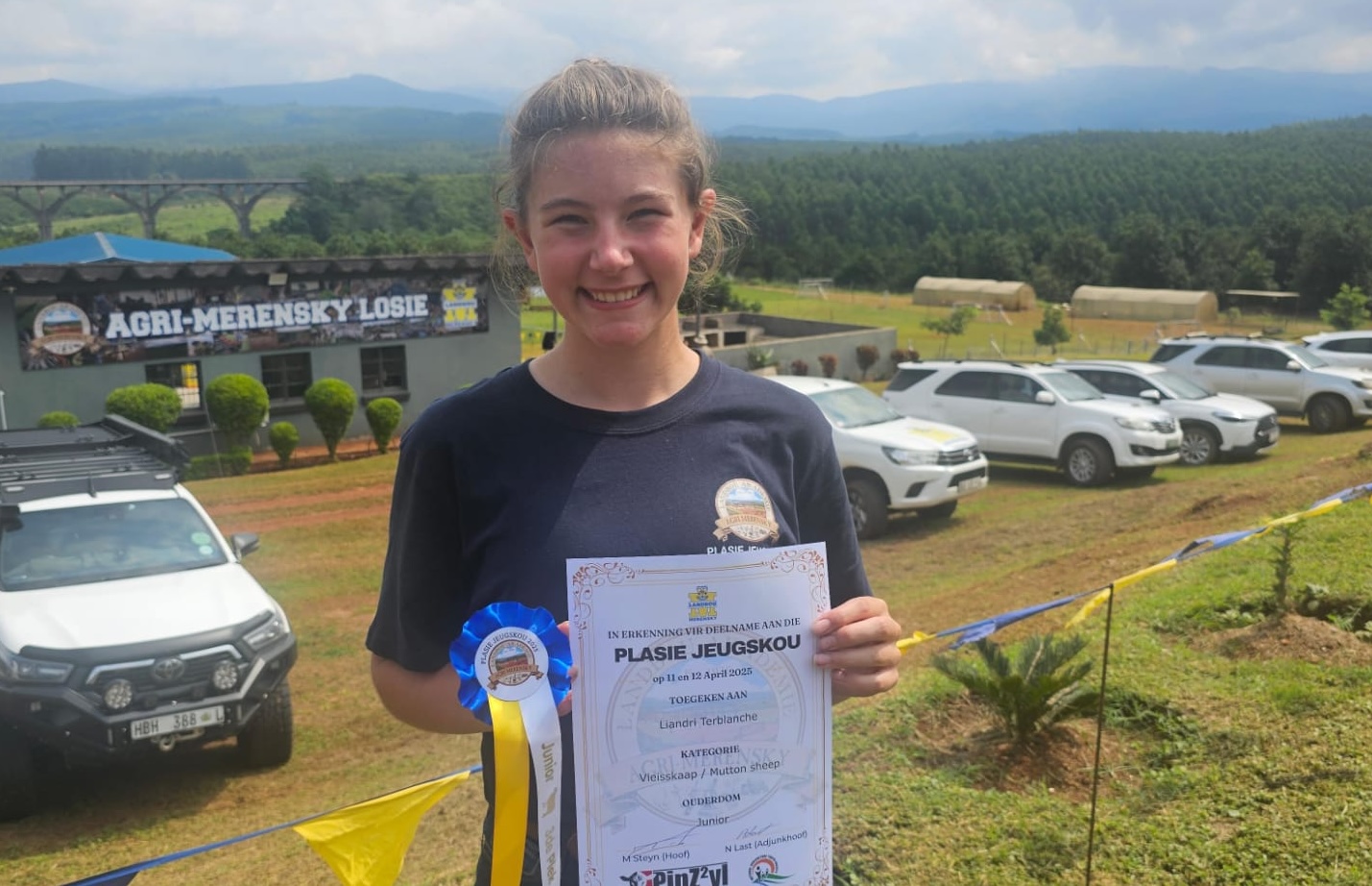 Girl in front of Agricultural show with her science prize